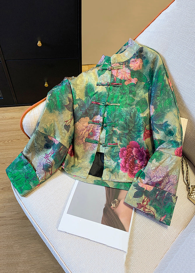 Close-up of the distinctive green button print on a luxurious women's silk blend coat. Stylish and fashionable outerwear.