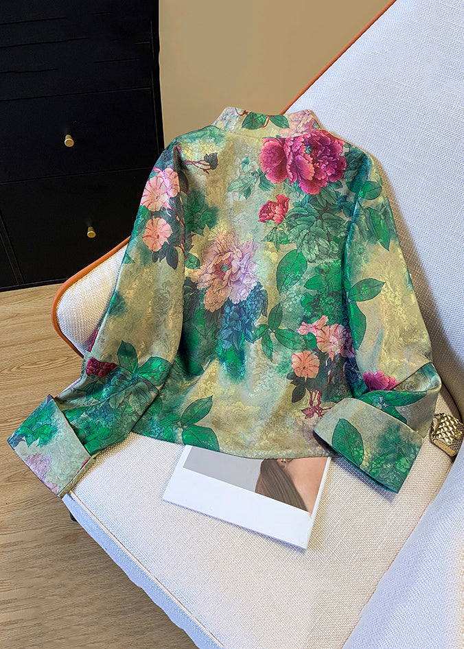 Full view of an elegant women's green print silk coat, showcasing its flowing silhouette and chic Chinese button details. Ideal winter coat.