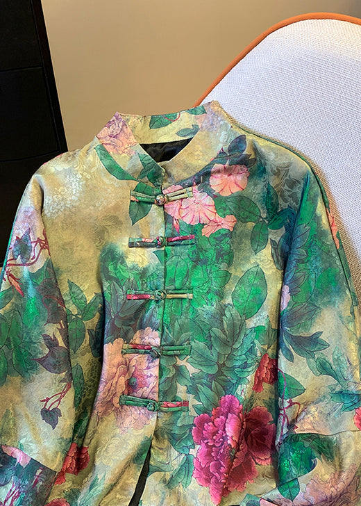 A stylish women's green silk coat featuring a unique button print pattern and elegant Chinese knot buttons. Fashionable outerwear for any season.