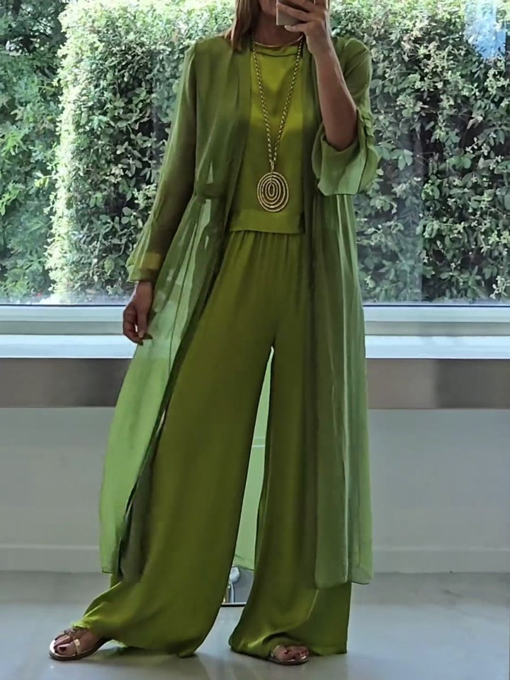 Elegant women's green three-piece lounge set. Comfortable cardigan, camisole & wide-leg pants for versatile chic style.