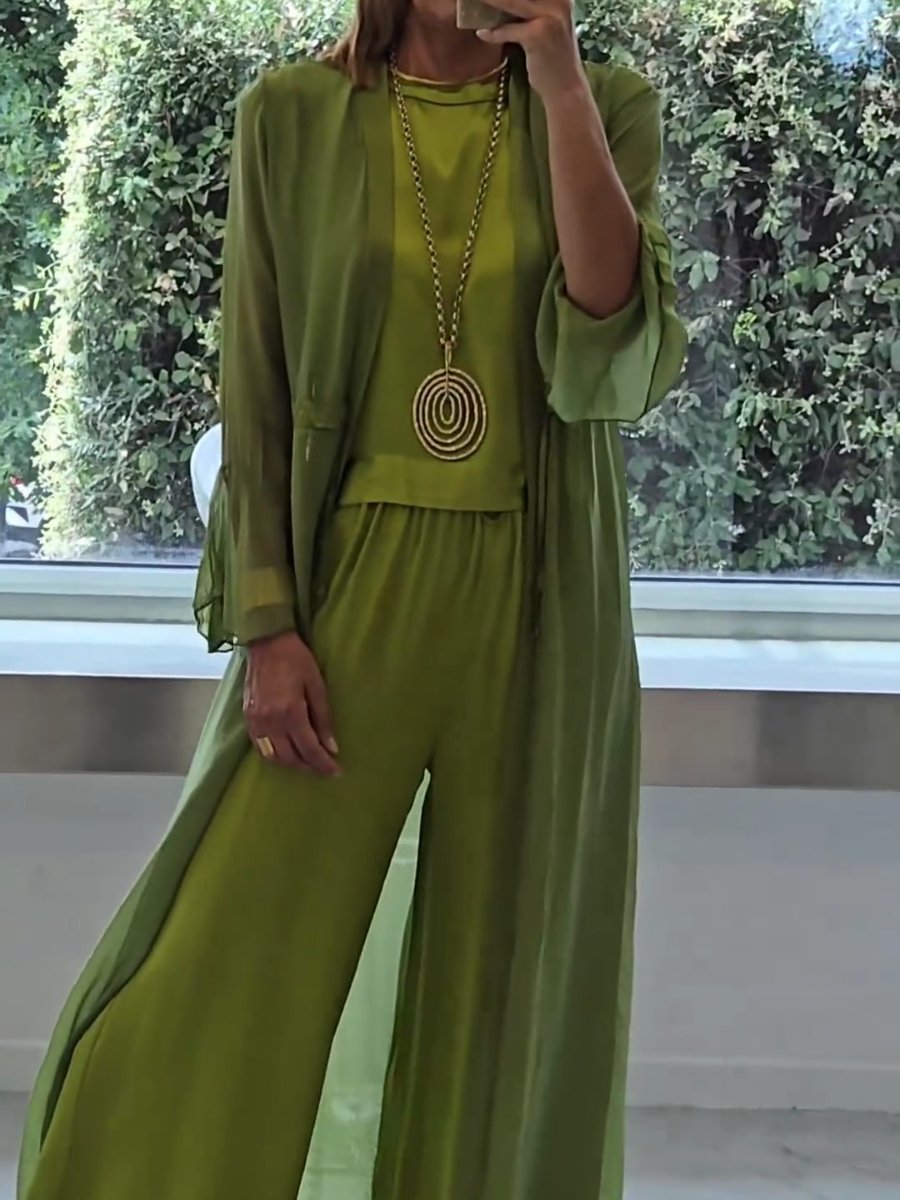 Stylish women's green three-piece lounge wear set. Elegant cardigan, comfortable cami & flowy pants for versatile casual chic.