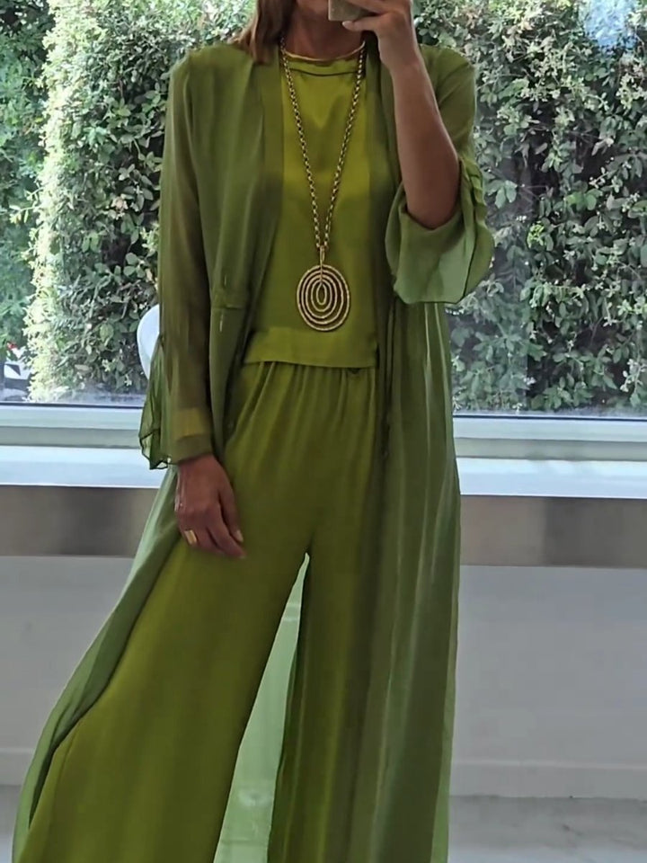 Stylish women's green three-piece lounge wear set. Elegant cardigan, comfortable cami & flowy pants for versatile casual chic.