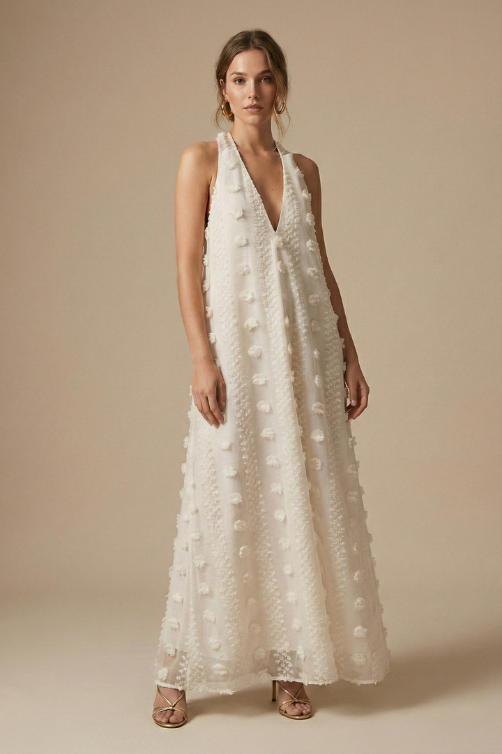 Elegant women's halter backless maxi dress with delicate floral appliqué, perfect for summer parties & special occasions.