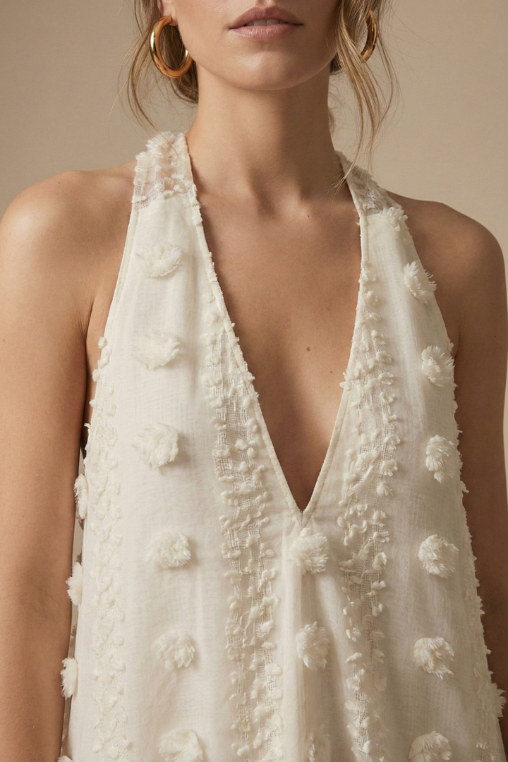 Flowy floral appliqué maxi dress for women, featuring a chic halter neck & backless design; ideal for resort wear.