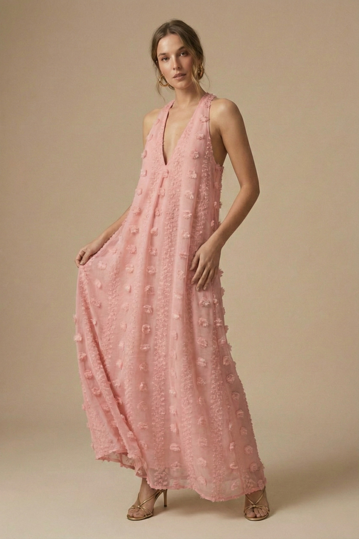 Women's elegant halter neck, backless maxi dress with exquisite floral appliqué, ideal for parties & special occasions.