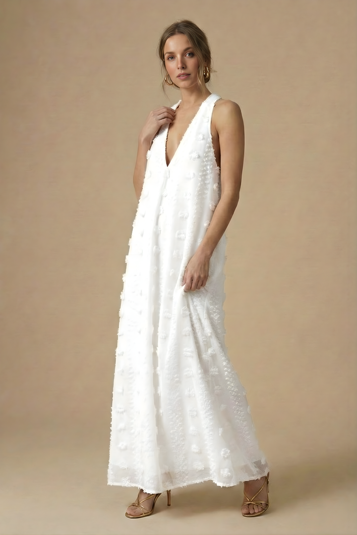 Stylish women's summer maxi dress: halter neck, backless, & vibrant floral appliqué, perfect for resort & evening wear.