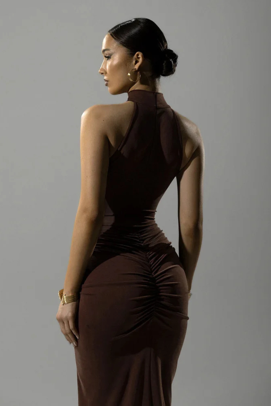 Women's elegant halter ruched slit maxi dress, sleeveless bodycon fit, ideal for formal parties.