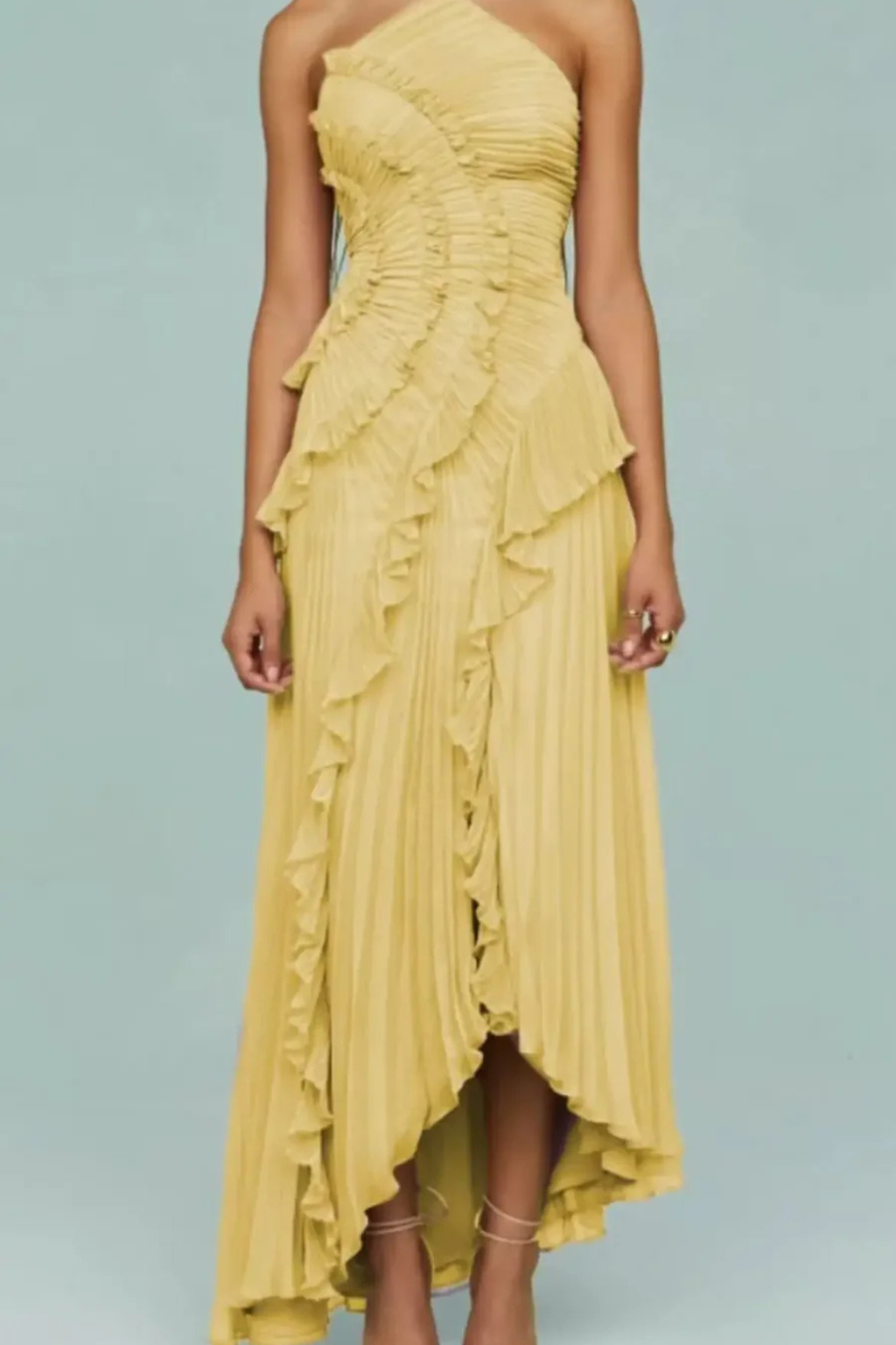 Pleated women's backless halter maxi dress with ruffles & asymmetric hem, chic for summer parties.