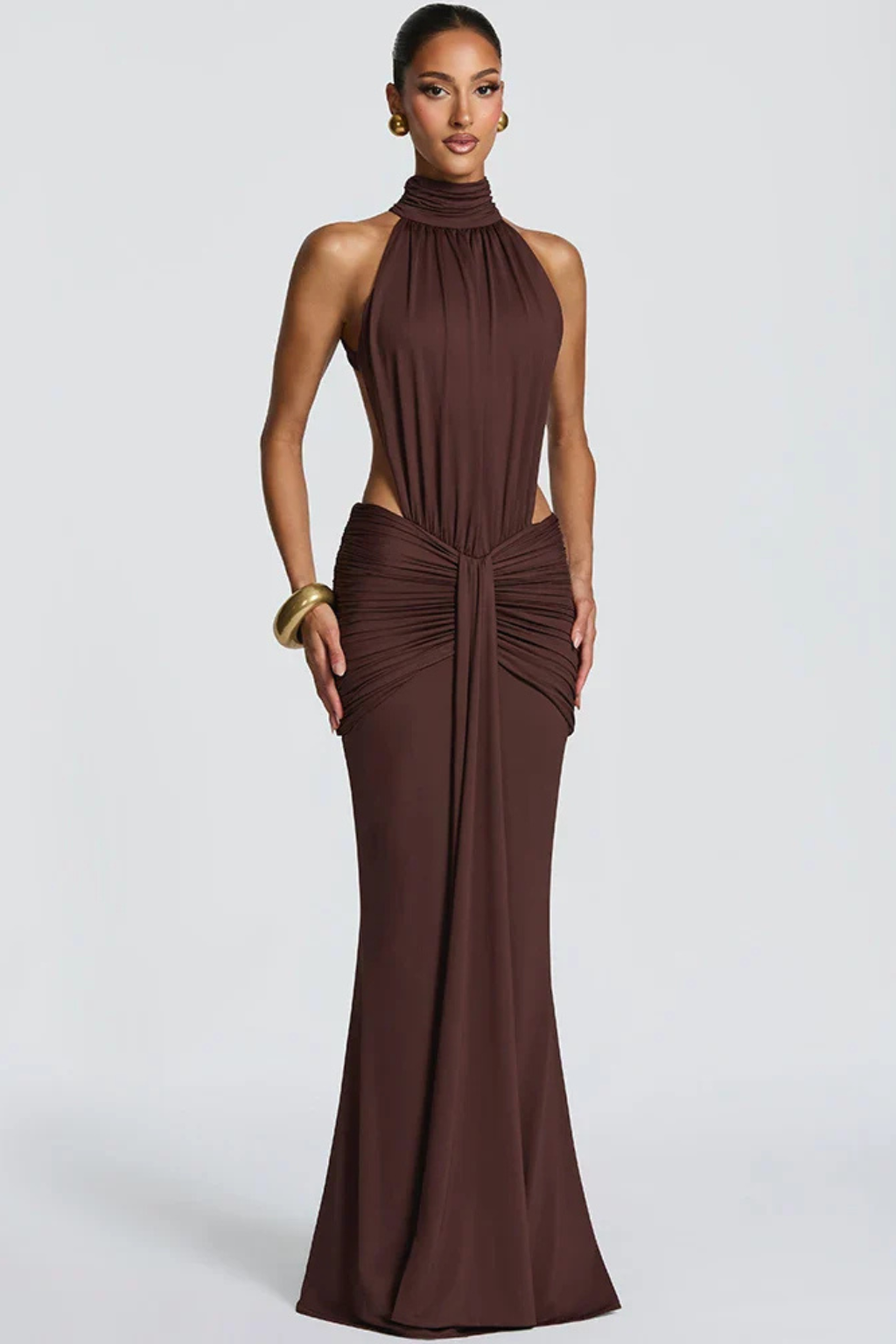 Stylish women's wedding guest maxi dress, featuring a halter neck, backless design, and ruched bodycon fit.