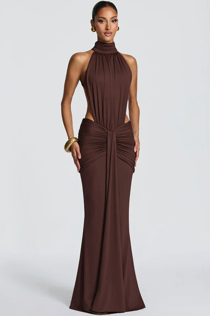 Stylish women's wedding guest maxi dress, featuring a halter neck, backless design, and ruched bodycon fit.