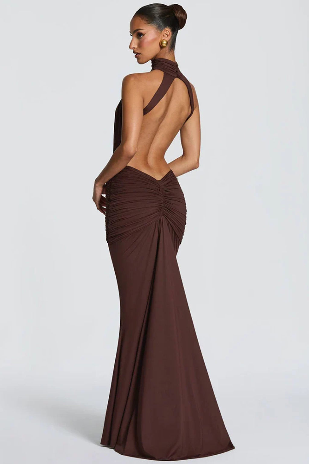 Sleek women's evening halter dress, ruched for a flattering bodycon fit. Ideal as a formal or cocktail maxi dress.