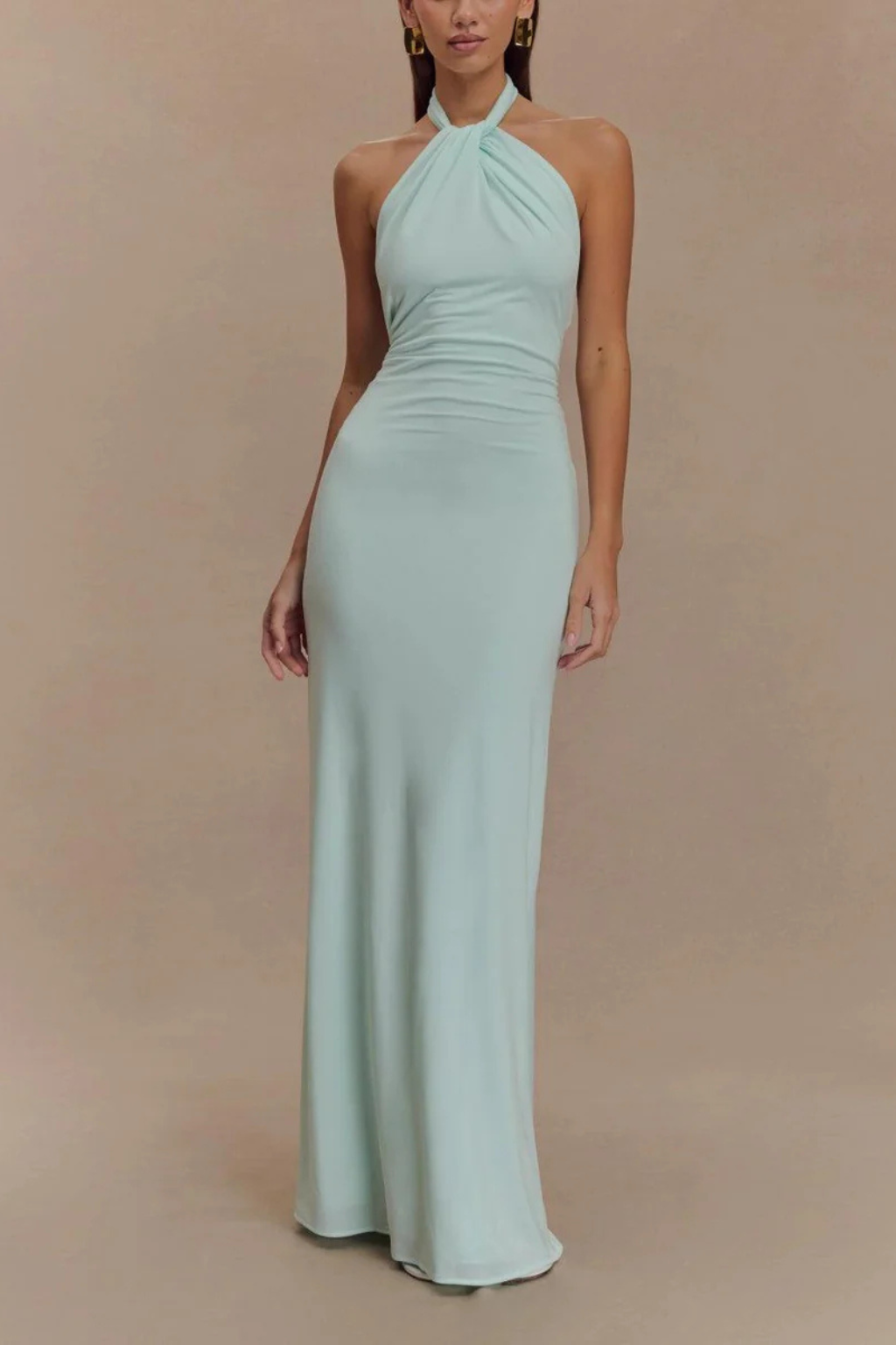 Chic sleeveless bodycon maxi dress featuring a halter neck and open back, ideal for formal parties.
