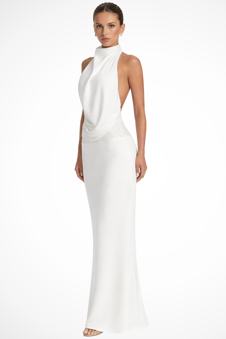 Draped maxi dress featuring a stylish halter neck, ideal as a wedding guest or elegant party gown.