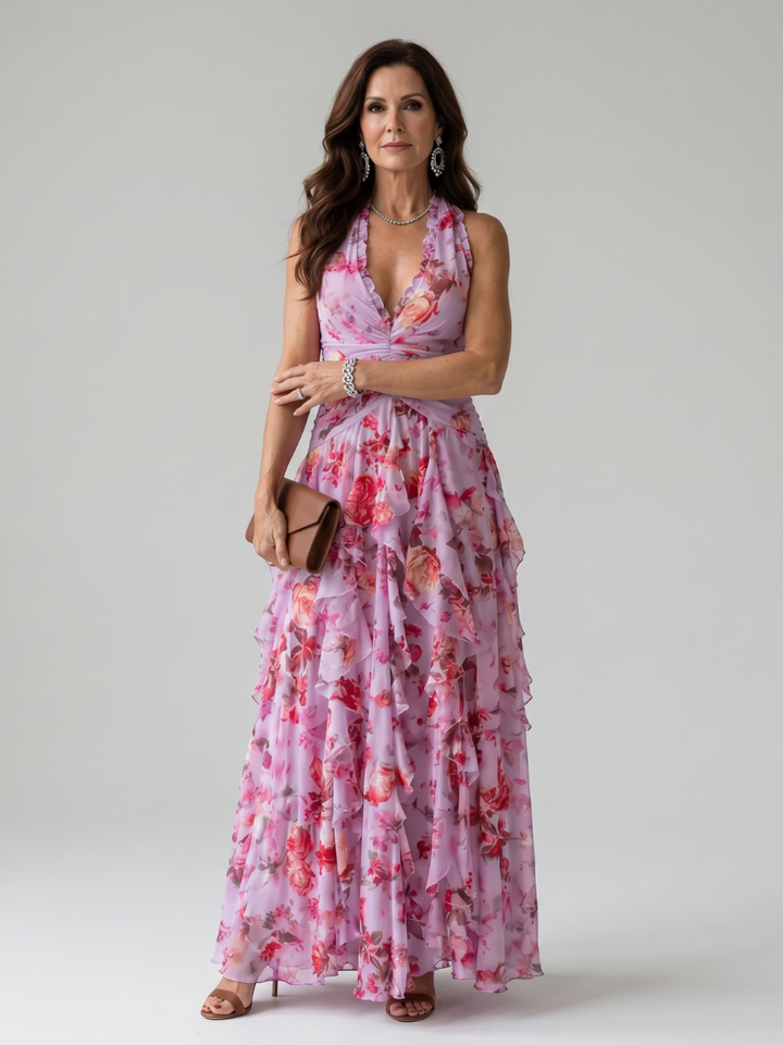 Elegant women's halter neck floral maxi dress with flowy skirt, perfect for summer parties.
