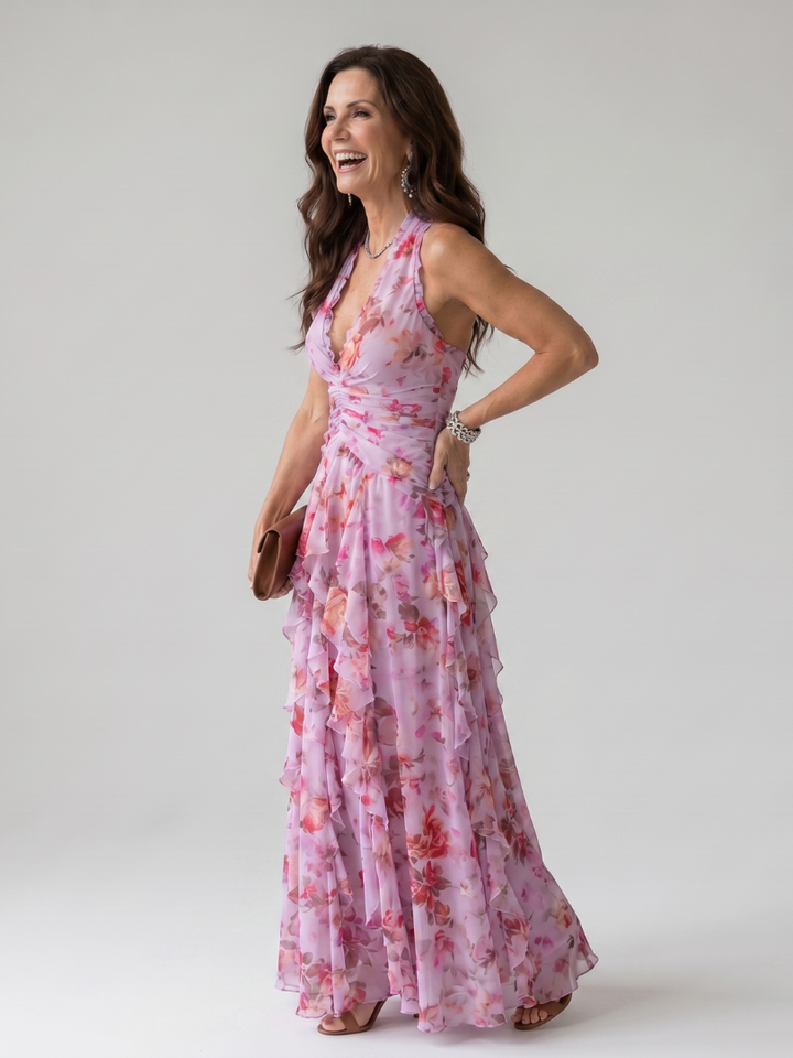 Women's elegant halter neck floral maxi dress featuring a stylish ruched bodice.