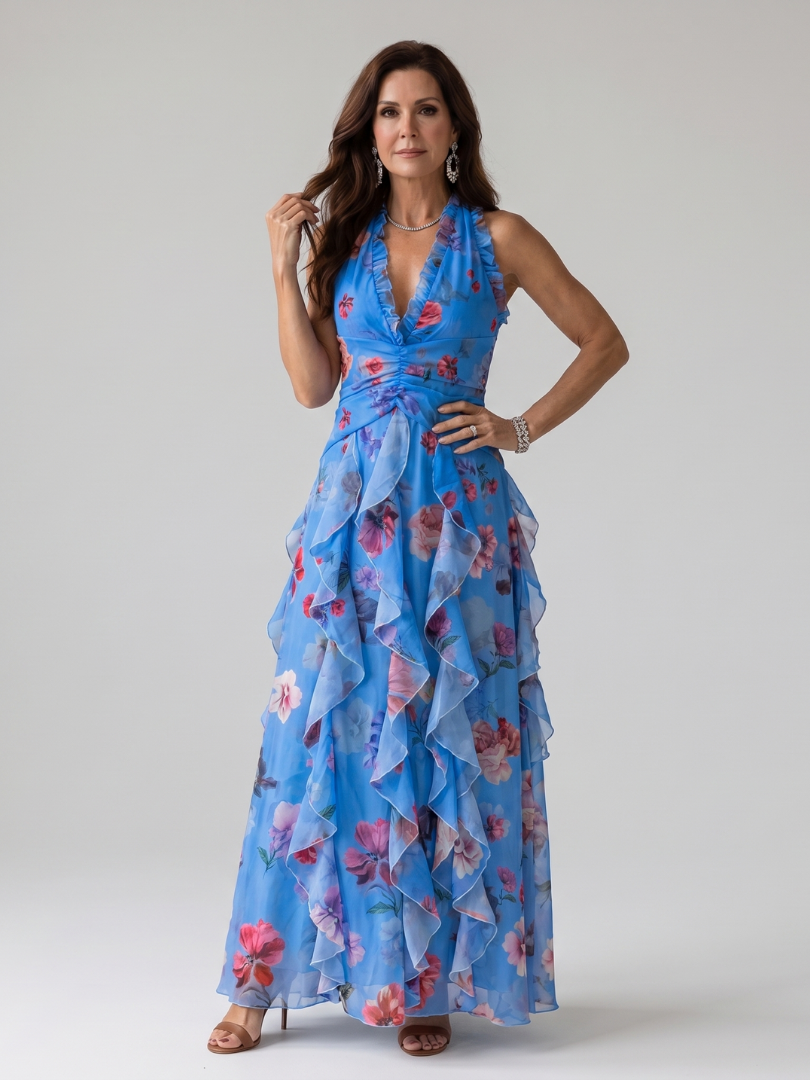 Full-length shot of a women's elegant floral halter neck maxi dress, showing its flowy silhouette.