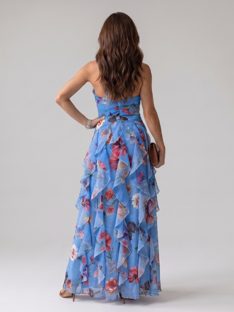 Close-up of the vibrant floral pattern on an elegant women's halter neck maxi dress.