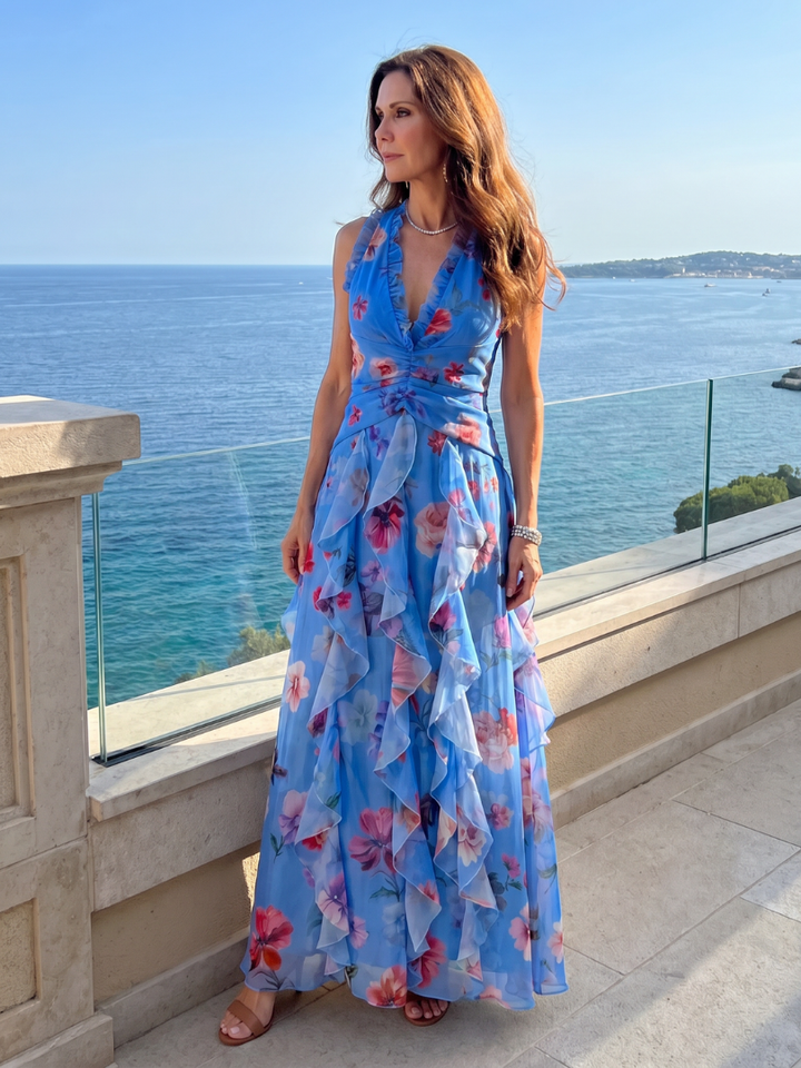 Back view of a women's halter neck floral maxi dress, highlighting the elegant neck design.
