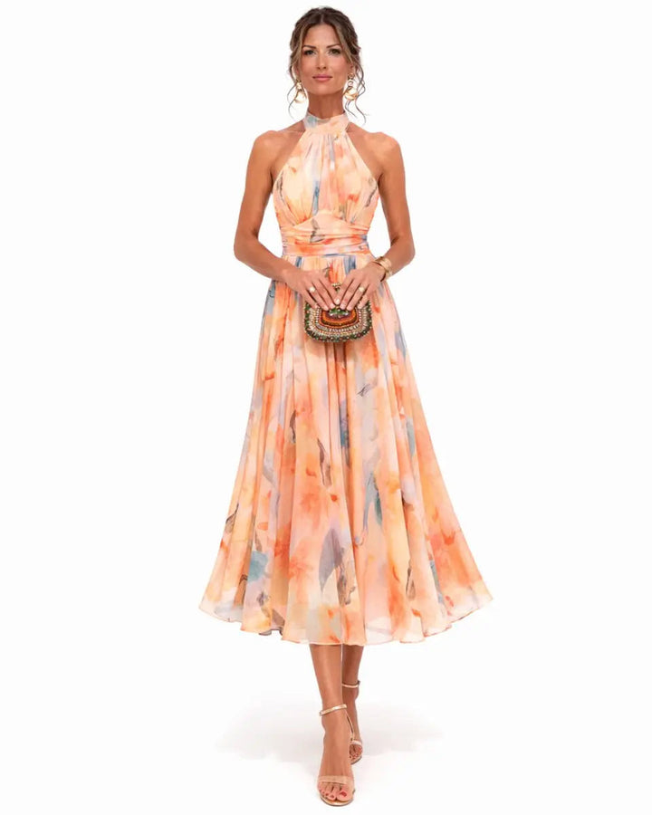 Elegant women's halter neck floral midi dress, perfect for summer garden parties or wedding guests.