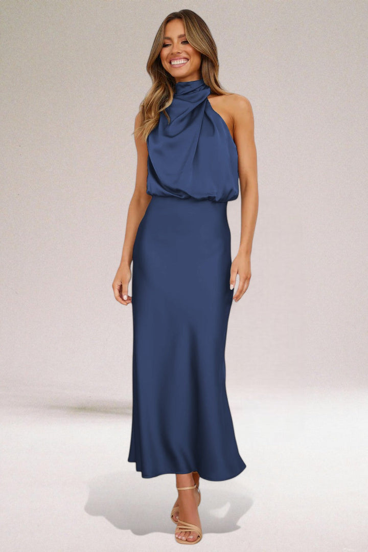 Plus size women's halter neck maxi dress. Versatile for formal events, evening wear, or elegant summer fashion.