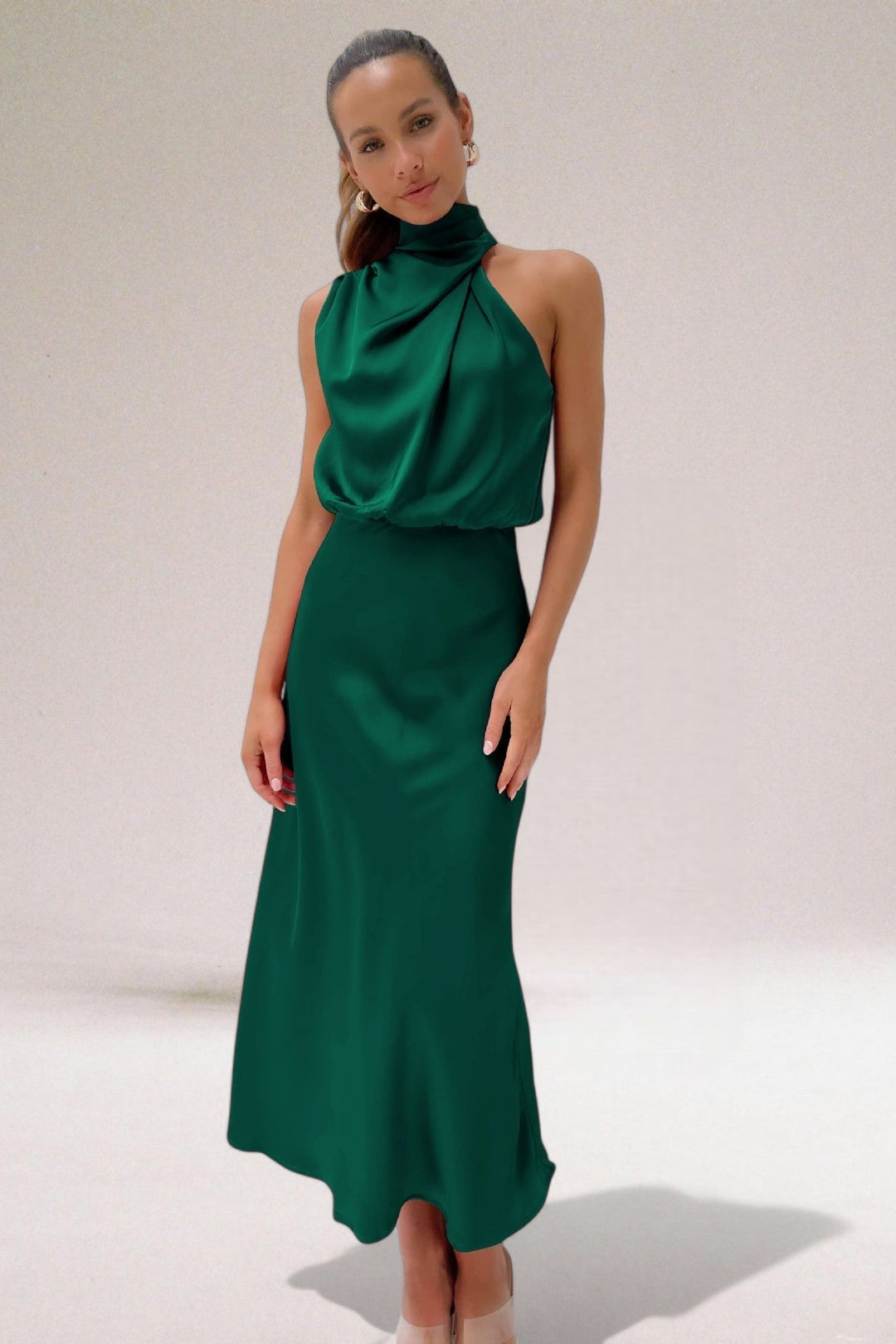 Stylish women's halter neck maxi dress. Excellent for elegant evening wear, summer parties, or formal events.