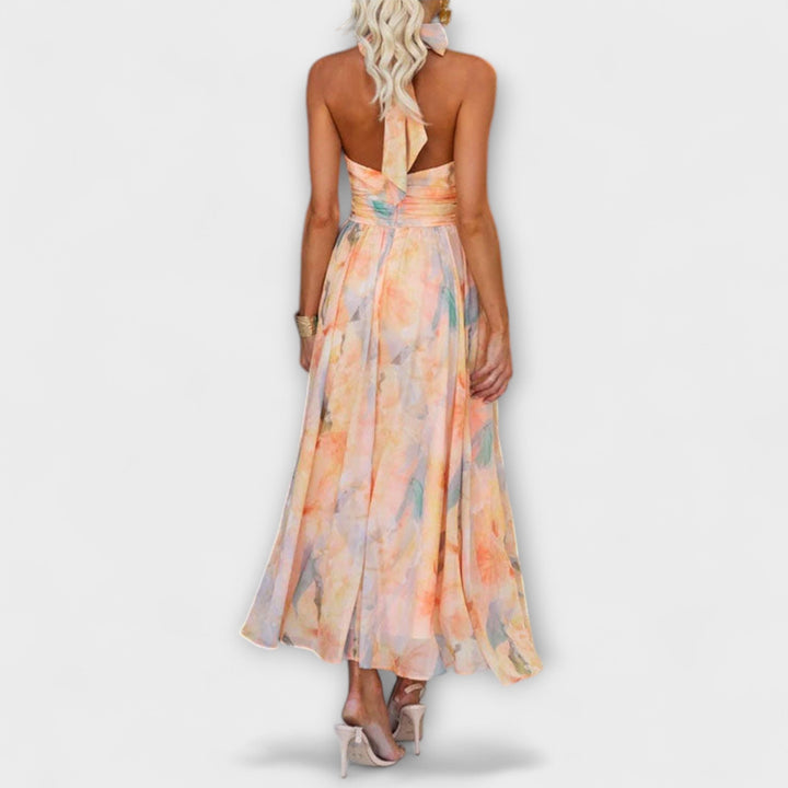 Chic women's gradient maxi dress with a flowy skirt and elegant halter neck, ideal for special occasions.