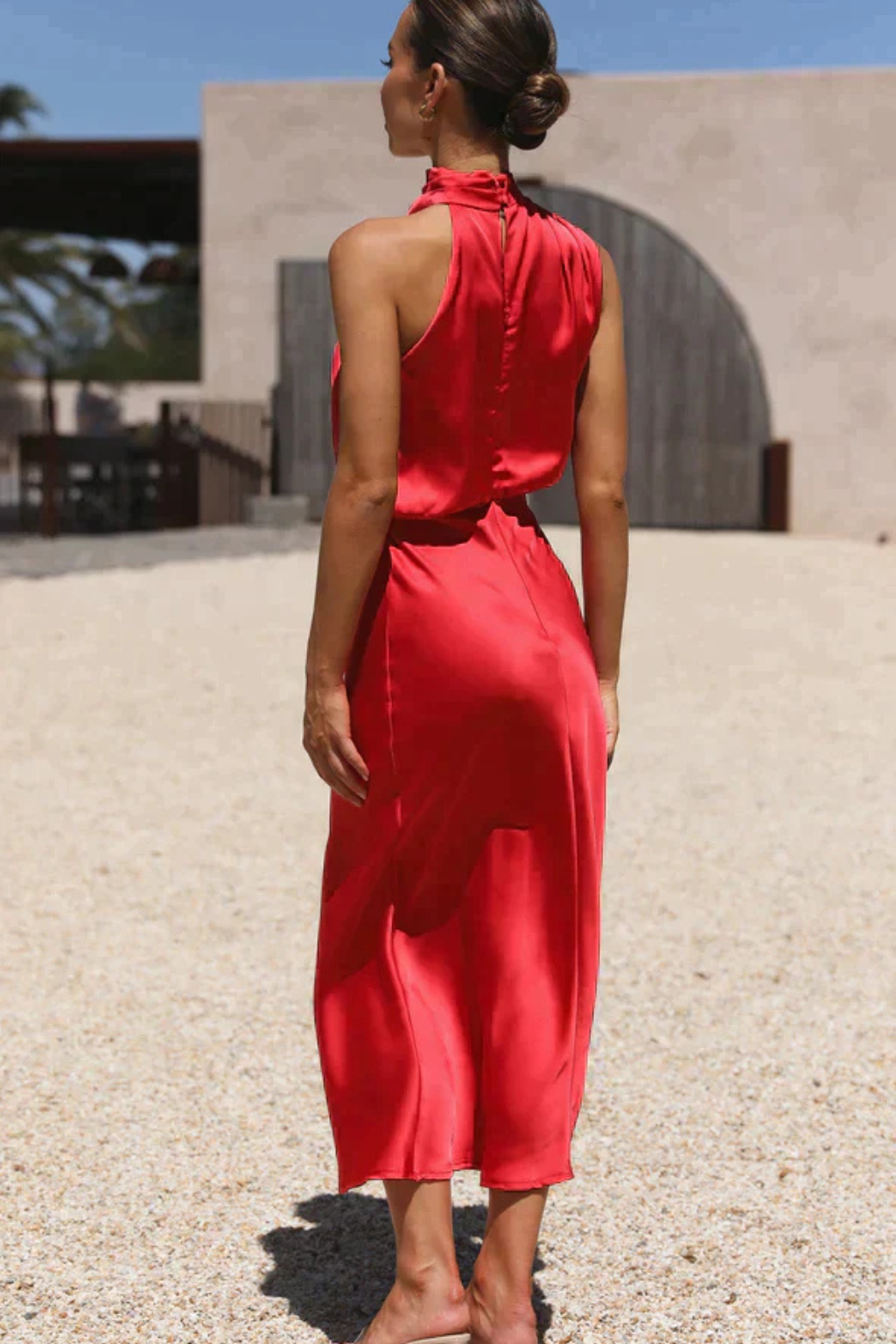 Stylish women's midi dress, designed with an elegant halter neck, great for any special event.