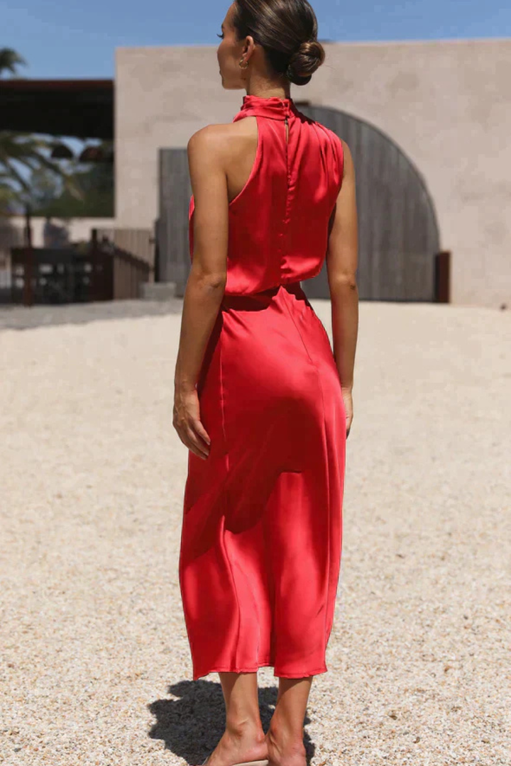 Stylish women's midi dress, designed with an elegant halter neck, great for any special event.