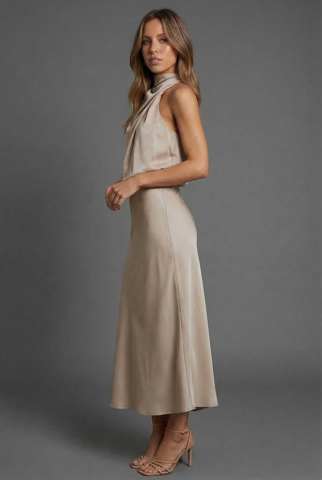 Sophisticated women's wedding guest midi dress with a stylish halter neckline.