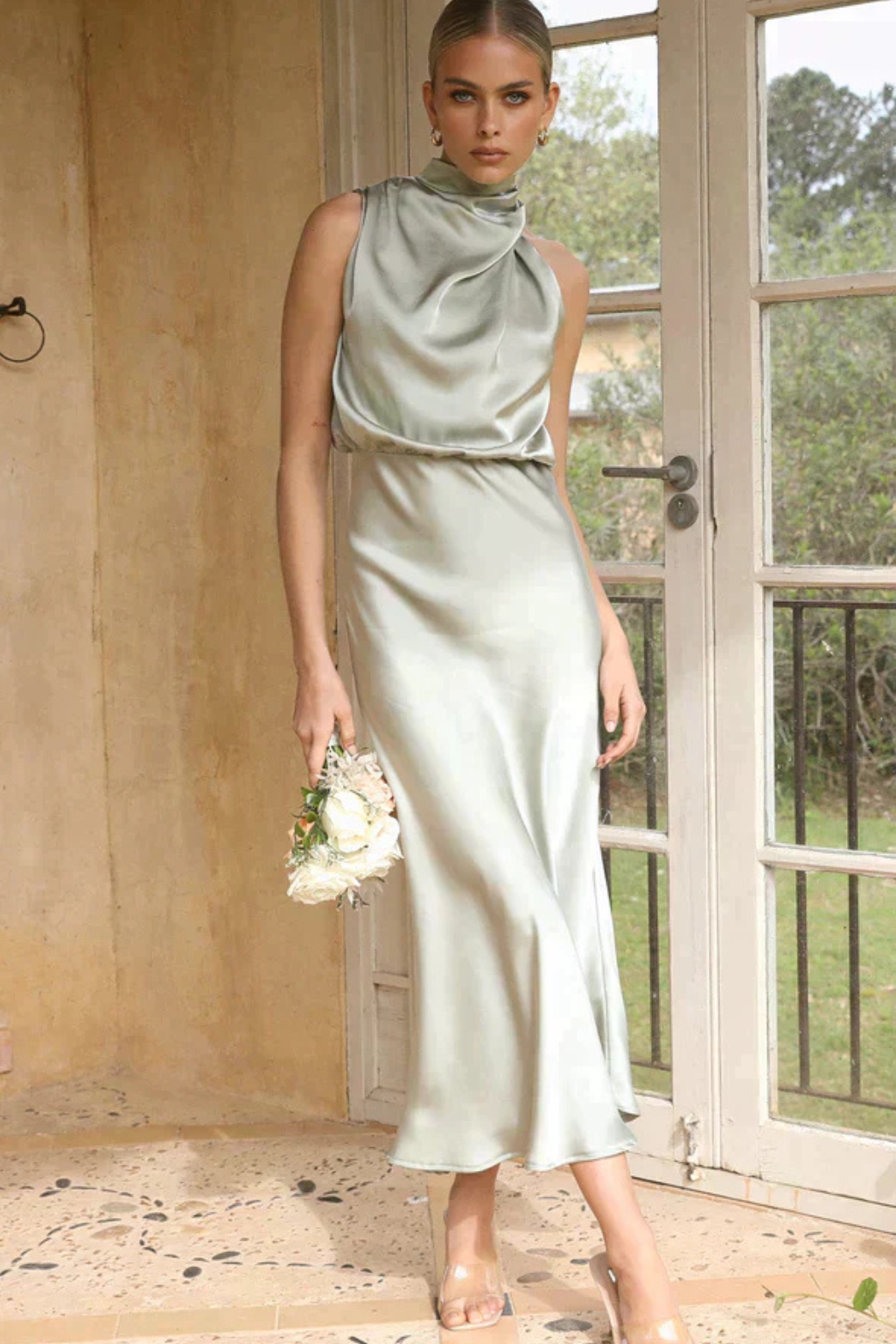 Stunning halter neck midi dress, a sophisticated choice for formal events and celebrations.