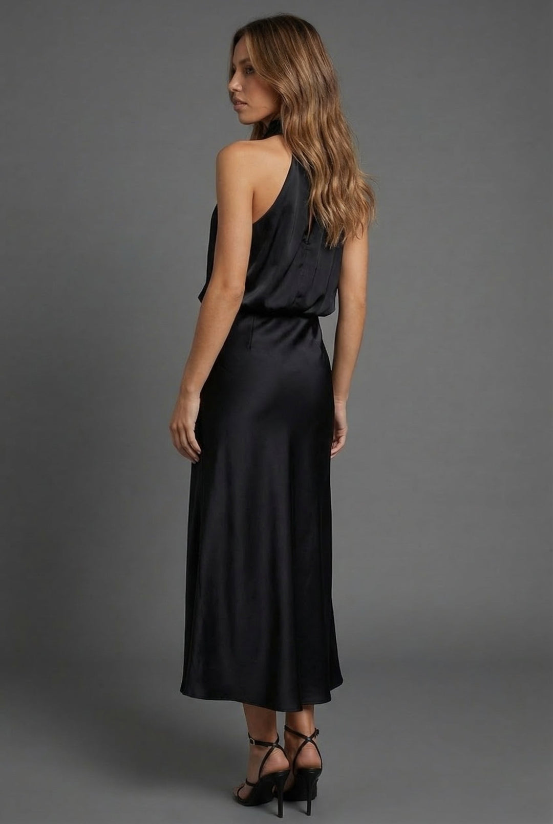 Sleek women's elegant midi dress, designed with a halter neck for wedding guests.