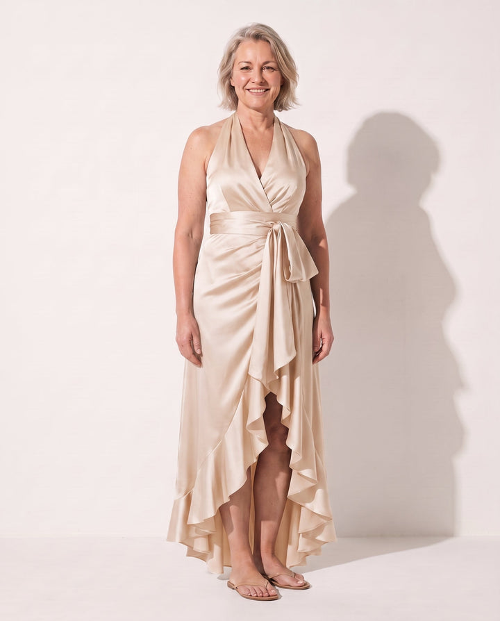 Stylish women's long halter neck dress. Features delicate ruffles & an elegant maxi silhouette, great for parties.