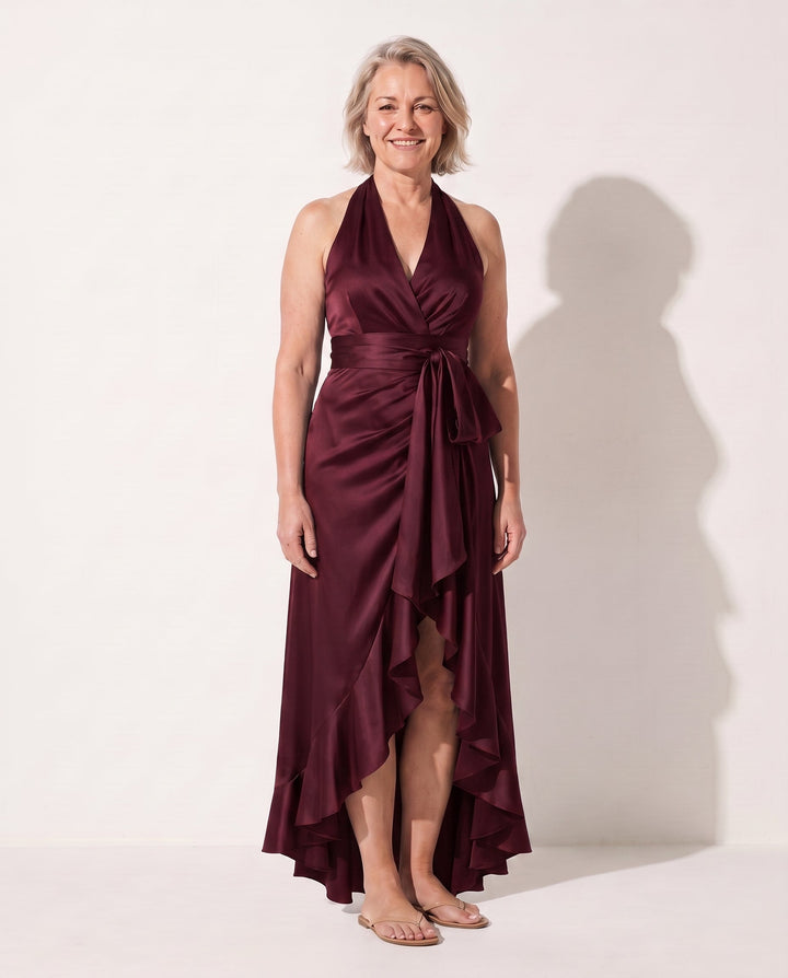 Versatile women's elegant halter neck maxi dress with ruffle details, suitable for black tie events & party wear.