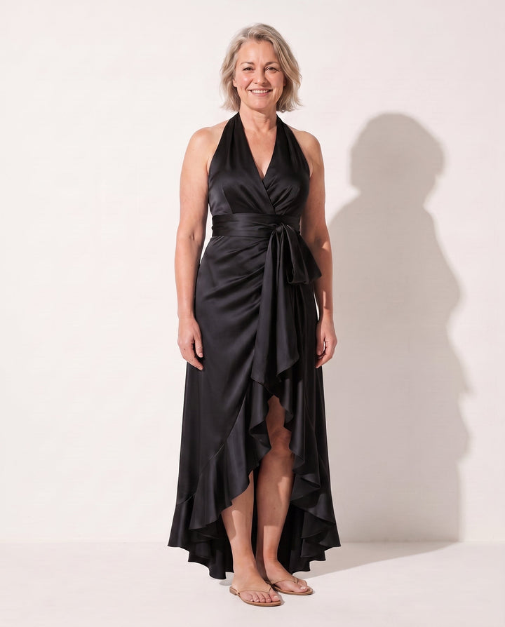 Chic women's elegant maxi dress with a flattering halter neck and stylish ruffle embellishments for formal evenings.