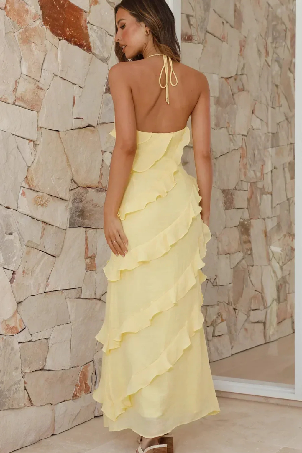 Comfortable women's summer maxi dress with a stylish halter neck and flowy ruffles. Perfect casual sundress.