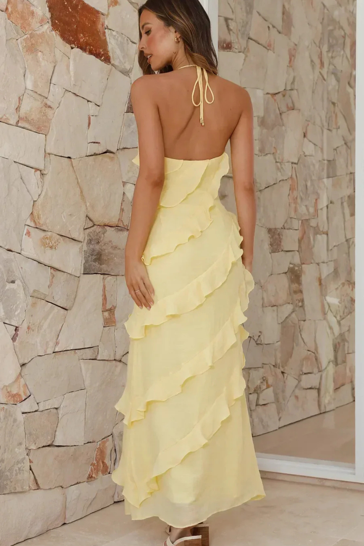 Comfortable women's summer maxi dress with a stylish halter neck and flowy ruffles. Perfect casual sundress.