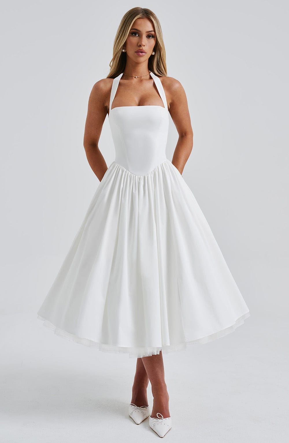 Elegant women's halter pleated midi dress with smocked bodice, perfect for summer parties.
