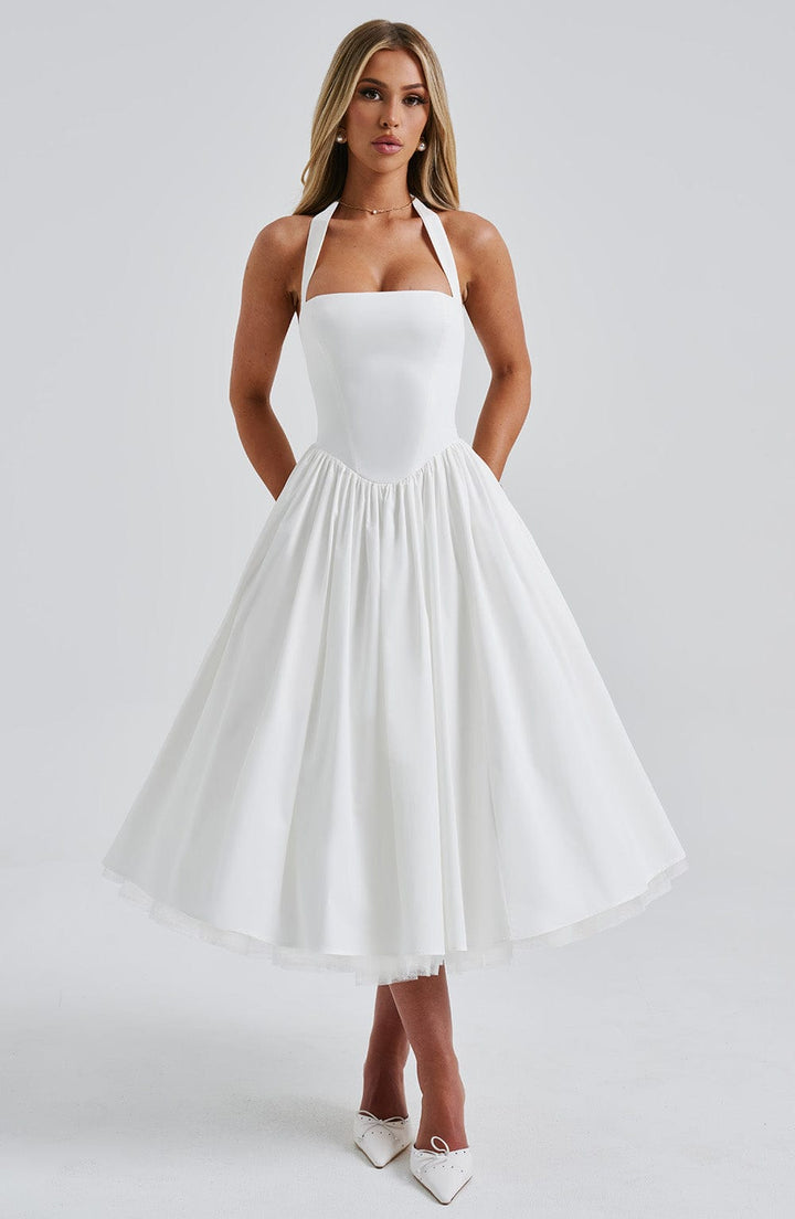 Elegant women's halter pleated midi dress with smocked bodice, perfect for summer parties.