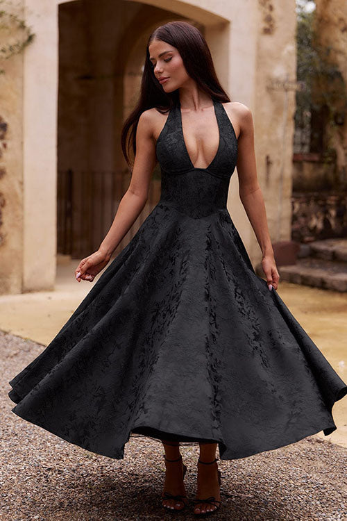 Women's fashion statement: elegant jacquard halter V-neck maxi dress, party ready.