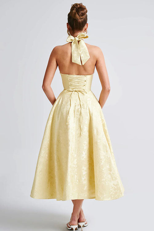 Elegant women's evening maxi dress, halter V-neck, with intricate jacquard pattern.