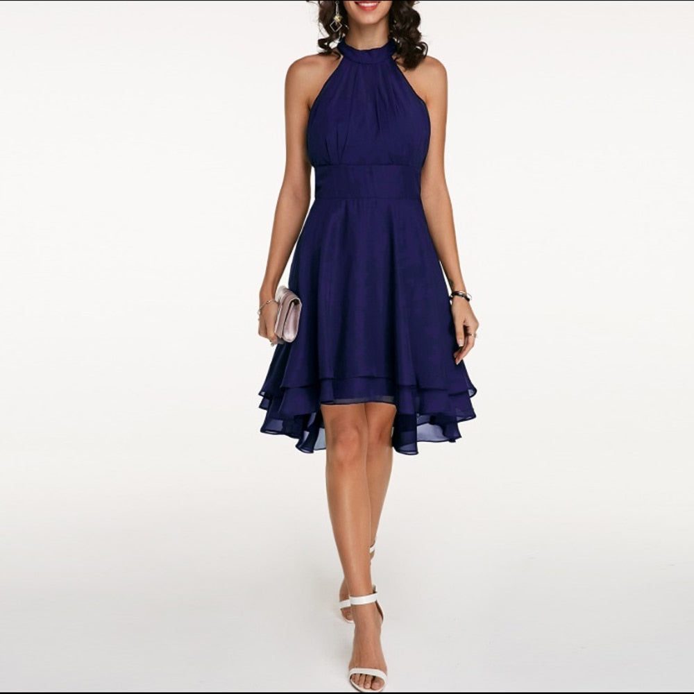 Flattering A-line halterneck cocktail dress for women, featuring an elegant ruffled hem and knee-length design.