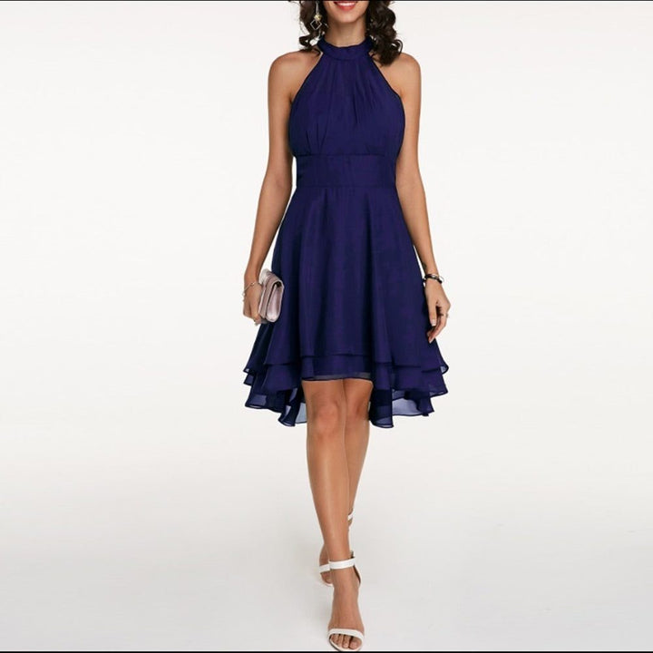 Flattering A-line halterneck cocktail dress for women, featuring an elegant ruffled hem and knee-length design.
