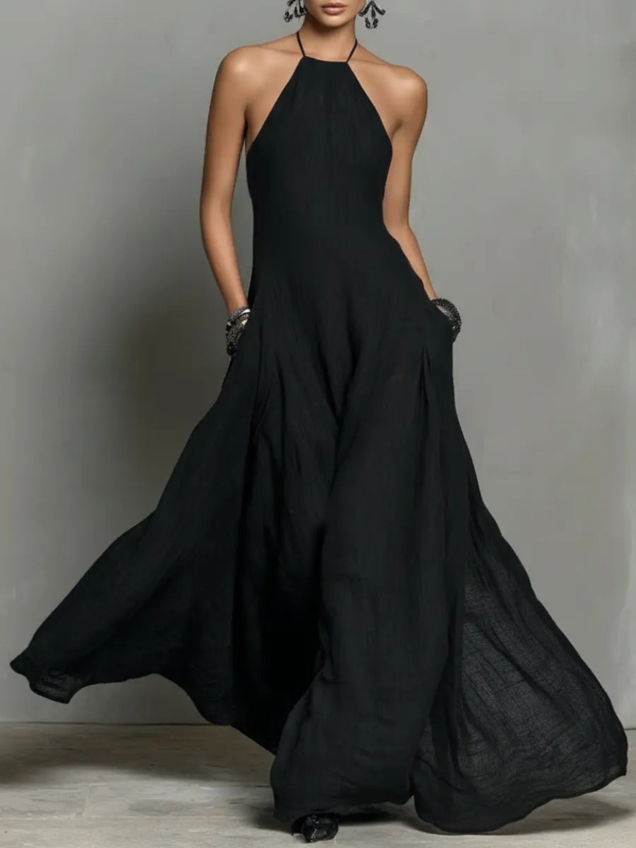 Elegant women's halterneck maxi dress, flowy fabric for summer vacation or evening wear.