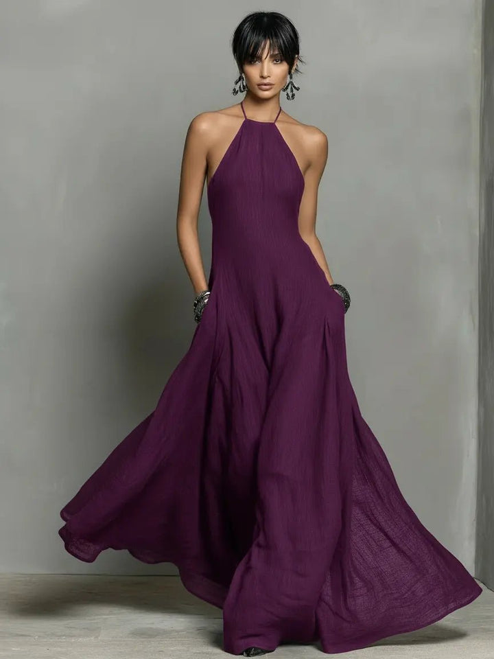 Women's elegant halterneck maxi dress, perfect summer vacation wear or sophisticated evening attire.