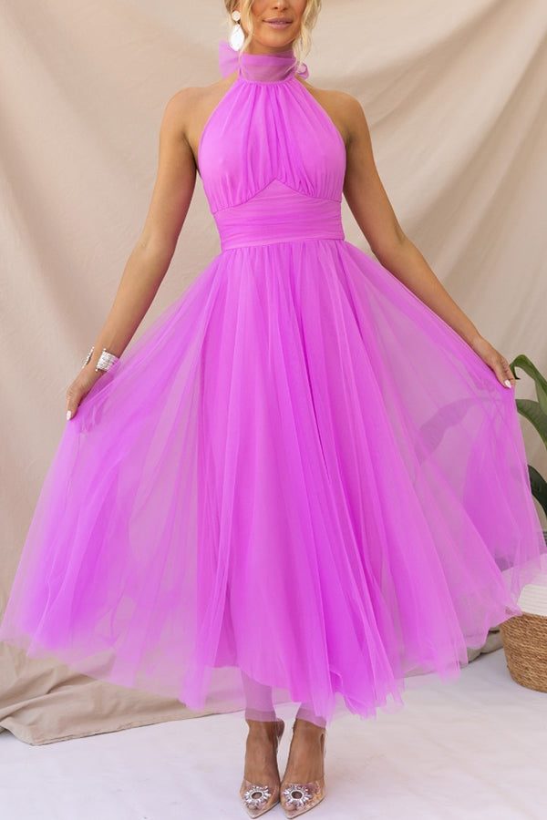 Elegant women's halterneck maxi dress for special occasions. Perfect for wedding guests or formal parties.