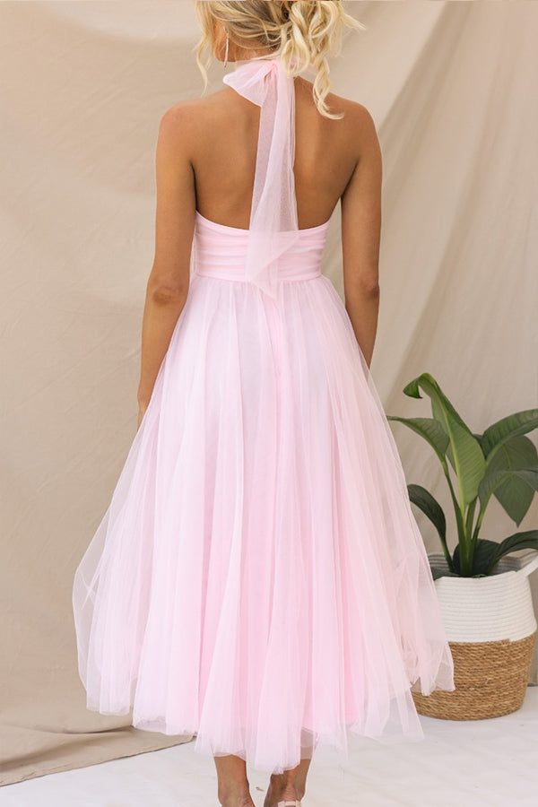 Statement women's formal halterneck maxi dress. An elegant A-line gown perfect for upscale special occasions.