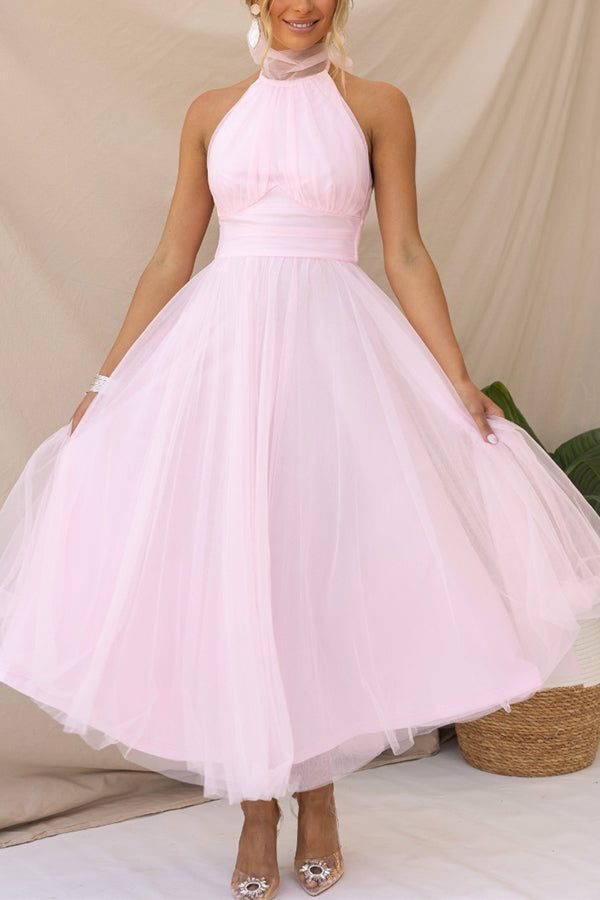 Sophisticated women's halterneck maxi dress. Perfect A-line gown for special evening events & parties.