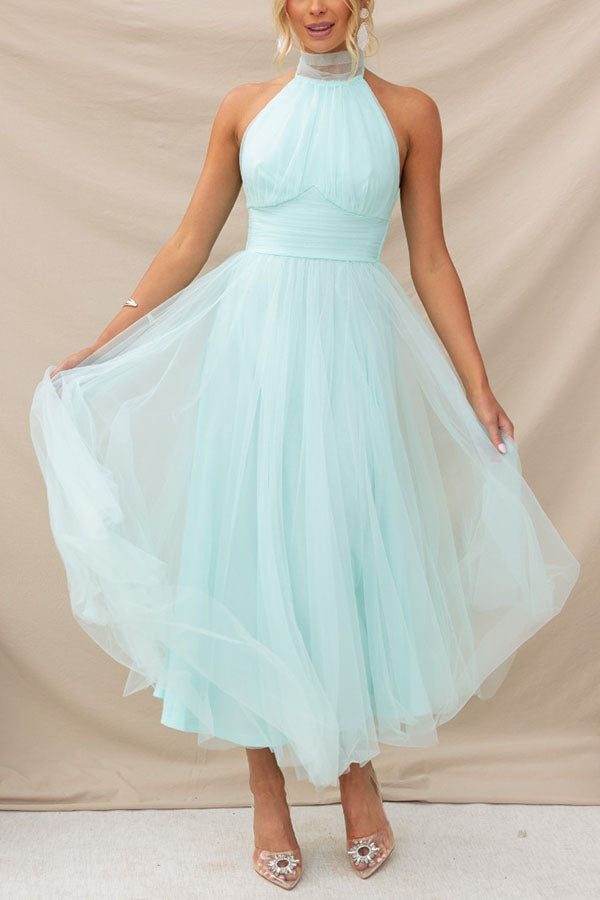 Women's elegant A-line halterneck maxi dress, ideal for weddings, galas, or special evening events.