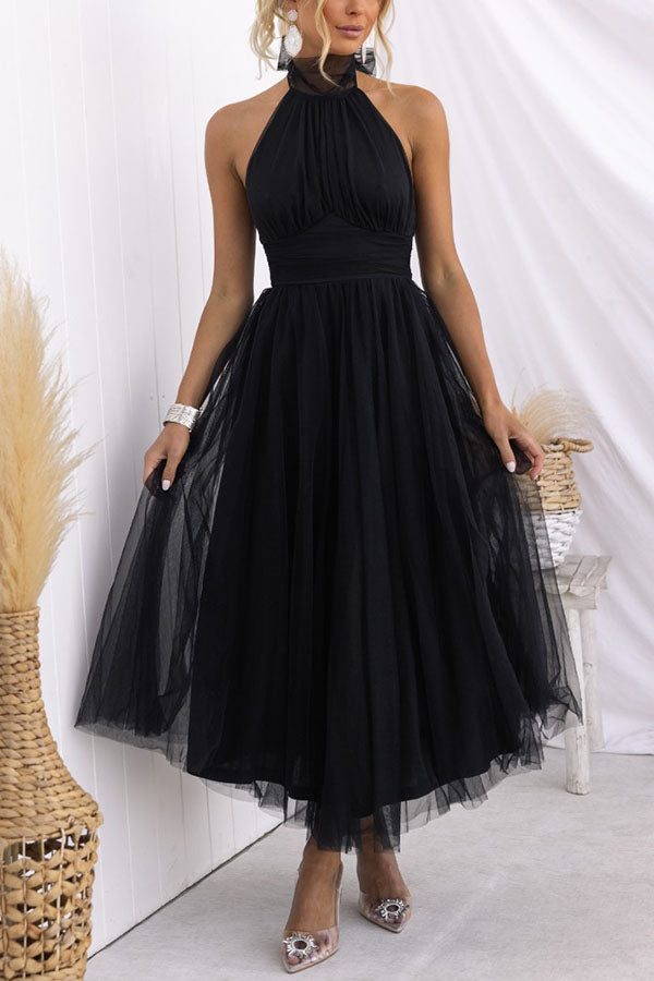 Stunning women's halterneck maxi dress with a flowing A-line skirt. Ideal for any special occasion.