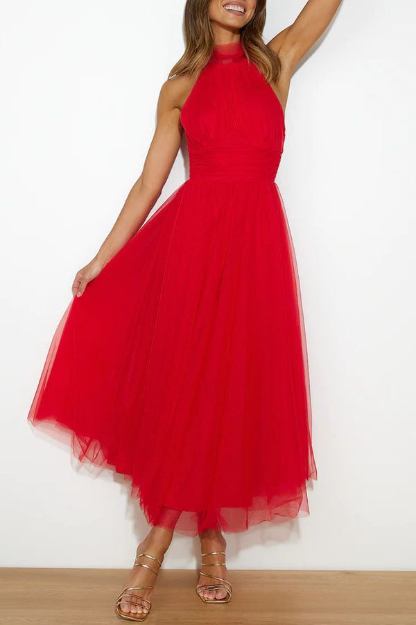 Chic sleeveless halterneck maxi dress for women. A-line silhouette, perfect for a wedding guest or formal party.